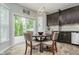 Eat-in kitchen features a cozy breakfast nook with sliding glass doors and modern lighting at 1274 Timber Bluff Rd, Westfield, IN 46074