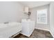 Functional laundry room with a sink, washer, dryer, storage shelf, and tiled floors at 1274 Timber Bluff Rd, Westfield, IN 46074