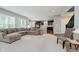 Open-concept layout connecting the living room and kitchen, with a large sectional sofa at 1274 Timber Bluff Rd, Westfield, IN 46074
