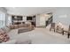 Bright living room featuring an open layout into the kitchen and staircase leading to the upper level at 1274 Timber Bluff Rd, Westfield, IN 46074