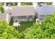 A well-maintained rear exterior featuring a neat lawn, complemented by a patio area accessible through sliding glass doors at 1274 Timber Bluff Rd, Westfield, IN 46074