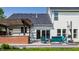 Spacious backyard featuring a deck with pergola, outdoor seating, and a white two-story home at 14805 Chamberlain Dr, Westfield, IN 46074