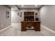 Basement office space features a large desk, overhead cabinets, and neutral paint at 14805 Chamberlain Dr, Westfield, IN 46074