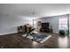 Spacious basement workout room with workout gear, TV, guitar, and laminate wood flooring at 14805 Chamberlain Dr, Westfield, IN 46074