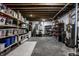 Unfinished basement area featuring plumbing, electrical box, and wooden storage shelves at 14805 Chamberlain Dr, Westfield, IN 46074