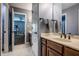 Bathroom with a view of an additional bedroom, with a dark wood vanity, granite countertop, and a stainless steel faucet at 14805 Chamberlain Dr, Westfield, IN 46074