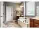 Relaxing bathroom retreat with a soaking tub, double vanity, and a separate shower at 14805 Chamberlain Dr, Westfield, IN 46074