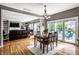 Open dining area with wooden table, chandelier, and sliding doors to outdoor patio at 14805 Chamberlain Dr, Westfield, IN 46074