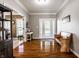 Elegant foyer showcasing hardwood floors, a decorative bench, and a welcoming atmosphere at 14805 Chamberlain Dr, Westfield, IN 46074