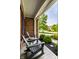 Cozy front porch featuring Adirondack chairs, lush landscaping, and a peaceful neighborhood view at 14805 Chamberlain Dr, Westfield, IN 46074