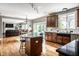 Spacious kitchen features wooden cabinets, granite countertops and stainless steel appliances adjacent to the dining and living rooms at 14805 Chamberlain Dr, Westfield, IN 46074
