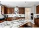 Modern kitchen with marble island, stainless steel appliances, and tiled backsplash at 14805 Chamberlain Dr, Westfield, IN 46074