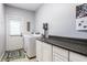 Functional laundry room with modern appliances, ample storage, and a convenient countertop at 14805 Chamberlain Dr, Westfield, IN 46074