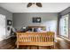 Comfortable main bedroom featuring hardwood floors, large windows, and neutral decor at 14805 Chamberlain Dr, Westfield, IN 46074