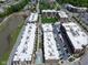Aerial view of the condos, showing the pool, green spaces, and parking at 15 W Executive Dr # 101, Carmel, IN 46032