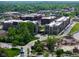 Extensive view of residential buildings surrounded by lush trees and landscaping, offering a serene environment at 15 W Executive Dr # 101, Carmel, IN 46032