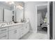 Stylish bathroom featuring double sinks, modern fixtures, and elegant finishes at 15 W Executive Dr # 101, Carmel, IN 46032