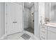 Modern bathroom features a glass shower, marble tile, and sleek white cabinetry at 15 W Executive Dr # 101, Carmel, IN 46032