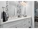 Modern bathroom boasts dual sinks, sleek countertops, and floral wallpaper accent wall at 15 W Executive Dr # 101, Carmel, IN 46032