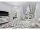 Bright bedroom featuring a view of the lush outdoor common area at 15 W Executive Dr # 101, Carmel, IN 46032
