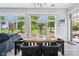 Bright dining room featuring views of the lush outdoor common area and modern decor at 15 W Executive Dr # 101, Carmel, IN 46032