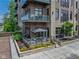 Stunning condominium with brick facade, glass balconies, and a private patio area at 15 W Executive Dr # 101, Carmel, IN 46032
