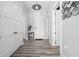 Bright hallway features hardwood floors, modern light fixtures, and white doors at 15 W Executive Dr # 101, Carmel, IN 46032