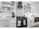 Well-equipped kitchen with modern appliances, open shelving, and bright lighting at 15 W Executive Dr # 101, Carmel, IN 46032