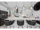 Modern kitchen with white cabinets, a large island, and stainless steel appliances at 15 W Executive Dr # 101, Carmel, IN 46032