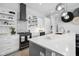 Contemporary kitchen with white cabinets, stainless steel appliances, and stylish backsplash at 15 W Executive Dr # 101, Carmel, IN 46032