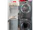 Compact laundry space with stacked washer/dryer unit, utility sink, and storage shelves at 15 W Executive Dr # 101, Carmel, IN 46032