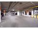 Spacious and well-lit parking garage with clearly marked parking spots and exit signs at 15 W Executive Dr # 101, Carmel, IN 46032