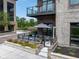 Charming patio with outdoor seating, umbrella, and planters in a courtyard setting at 15 W Executive Dr # 101, Carmel, IN 46032