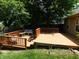 Large backyard deck area ideal for outdoor gatherings and enjoying the surrounding greenery at 1612 Prairieview Ln, Greenfield, IN 46140
