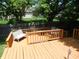 Comfortable outdoor deck with ample seating, perfect for enjoying the tranquility of the backyard at 1612 Prairieview Ln, Greenfield, IN 46140
