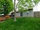Spacious backyard with a wooden deck, perfect for outdoor entertaining and relaxation at 1612 Prairieview Ln, Greenfield, IN 46140
