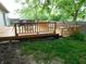 Backyard featuring wooden deck with a grill and outdoor seating in a fenced in yard at 1612 Prairieview Ln, Greenfield, IN 46140