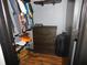 Well-organized closet with clothes, dresser, luggage, and flooring at 1612 Prairieview Ln, Greenfield, IN 46140