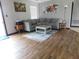 Inviting living room featuring hardwood floors, a comfortable sectional sofa, and stylish decor at 1612 Prairieview Ln, Greenfield, IN 46140