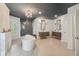 Expansive bathroom with a soaking tub, dual vanities, modern fixtures, and a beautifully tiled shower enclosure at 1616 N Delaware St, Indianapolis, IN 46202