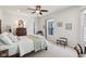 Well-lit bedroom with a four-poster bed, neutral carpet, and bright windows, offering a serene retreat at 1616 N Delaware St, Indianapolis, IN 46202