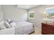 Bright bedroom with natural light, neutral walls, and comfortable bed with stylish patterned pillows at 1616 N Delaware St, Indianapolis, IN 46202