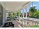 Comfortable front porch area with seating, hanging plants, and views of the neighborhood at 1616 N Delaware St, Indianapolis, IN 46202