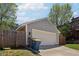 Detached two-car garage with siding, concrete driveway, and space for parking at 1616 N Delaware St, Indianapolis, IN 46202
