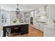 Bright kitchen with a large island, white cabinetry, stainless appliances, and subway tile backsplash at 1616 N Delaware St, Indianapolis, IN 46202