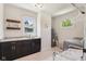 Updated laundry area with granite countertops, modern cabinetry, washer/dryer, and lots of natural light at 1616 N Delaware St, Indianapolis, IN 46202
