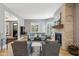Bright living room with stone fireplace, hardwood floors, neutral paint, and natural light at 1616 N Delaware St, Indianapolis, IN 46202