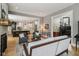 Open-concept living area flowing into a kitchen, featuring hardwood floors and modern decor at 1616 N Delaware St, Indianapolis, IN 46202