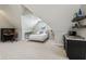 Cozy upstairs living space featuring a mini bar, desk, and a bed at 1616 N Delaware St, Indianapolis, IN 46202