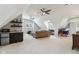 Upper level living room featuring mini bar, sloped ceilings, and lots of open space at 1616 N Delaware St, Indianapolis, IN 46202